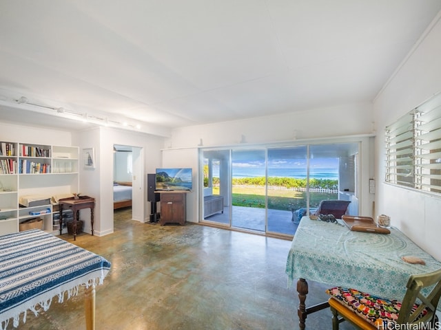 bedroom featuring access to outside and concrete flooring