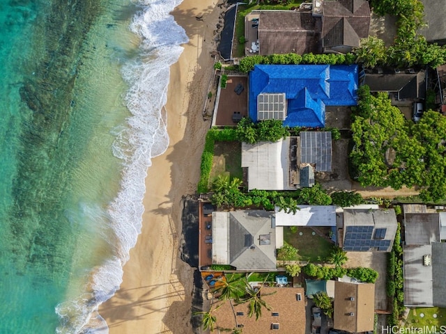 bird's eye view with a water view and a beach view