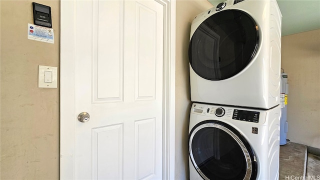 laundry area featuring stacked washing maching and dryer