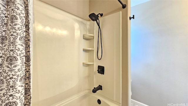 bathroom with shower / bath combo