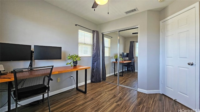 office space featuring dark wood-type flooring and ceiling fan