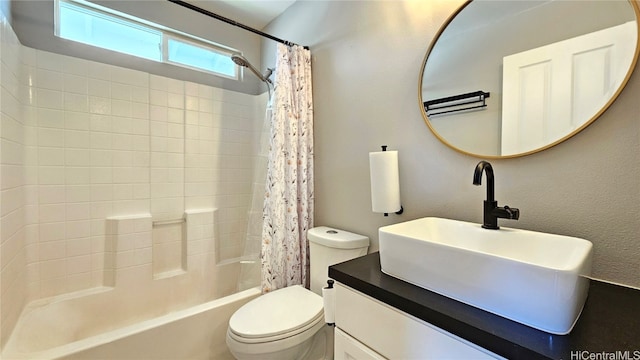 full bathroom featuring vanity, toilet, and shower / bathtub combination with curtain