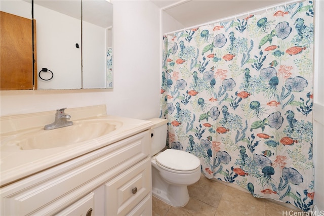 bathroom featuring tile patterned flooring, vanity, a shower with shower curtain, and toilet