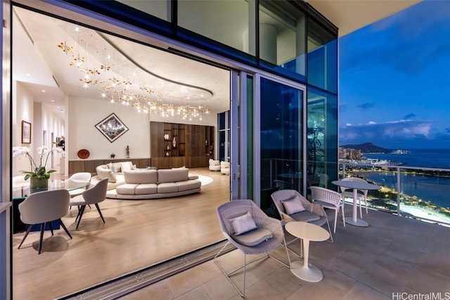 view of patio / terrace with an outdoor hangout area and a water view