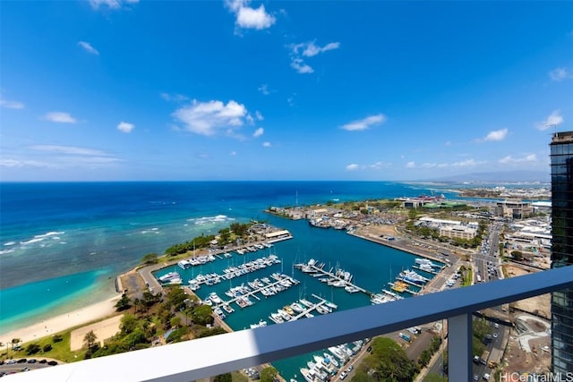 birds eye view of property with a beach view and a water view