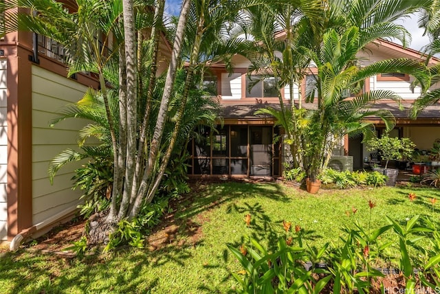 view of yard featuring a sunroom