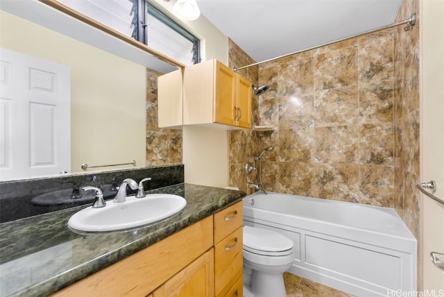 full bathroom featuring vanity, tile patterned floors, tiled shower / bath, and toilet