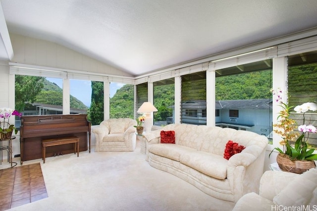 sunroom featuring lofted ceiling