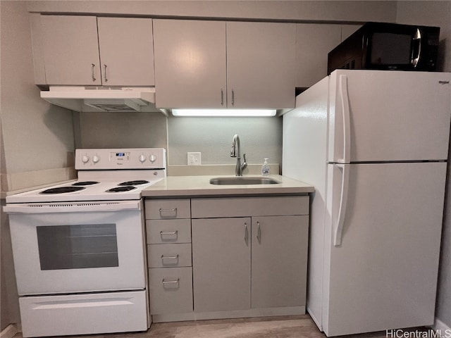 kitchen with sink and white appliances