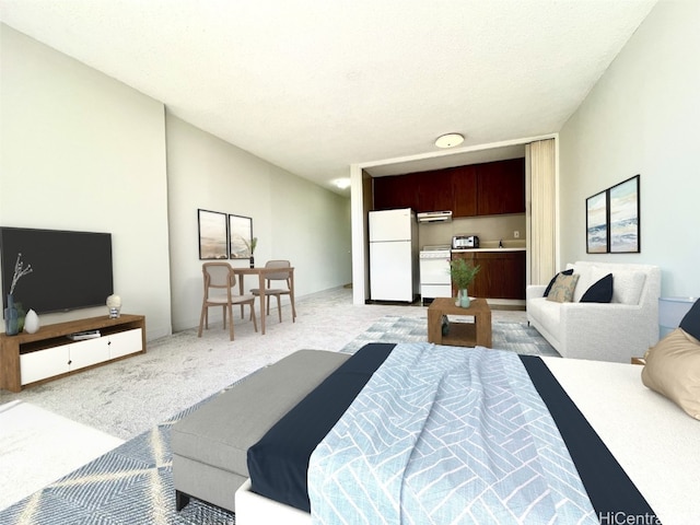 carpeted bedroom featuring a textured ceiling and white fridge