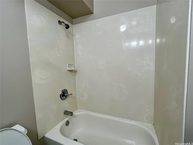 bathroom with shower / tub combination and toilet