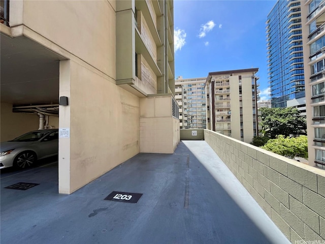 exterior space with stucco siding and a city view