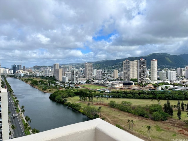 exterior space featuring a mountain view and a city view