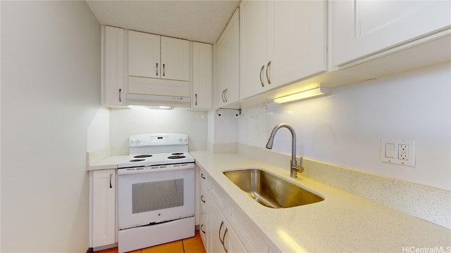 kitchen featuring sink, white electric range, white cabinets, and light tile patterned floors