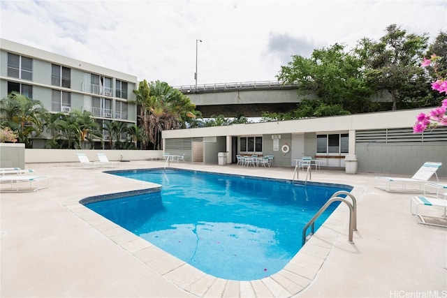 view of swimming pool featuring a patio area