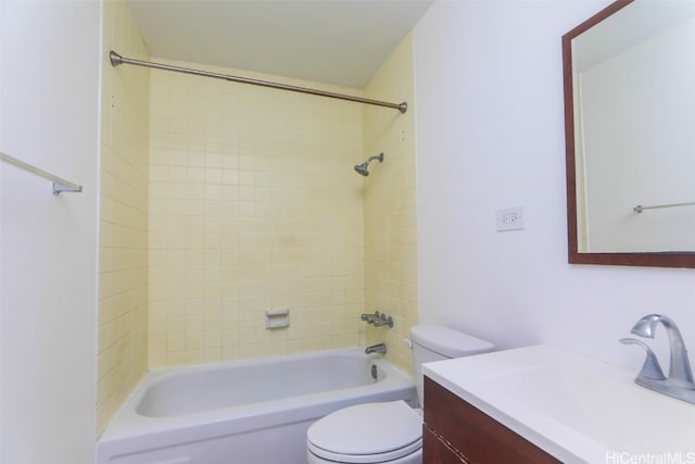 full bathroom with vanity, tiled shower / bath combo, and toilet