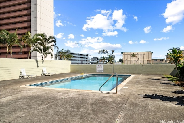 view of pool featuring a patio