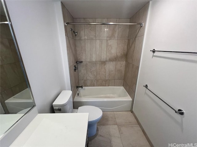 full bathroom with tiled shower / bath, vanity, and toilet