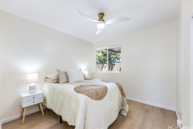 bedroom featuring light wood-type flooring and ceiling fan