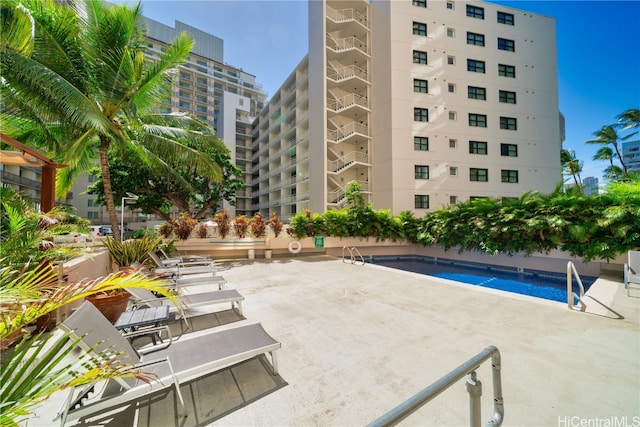 view of swimming pool with a patio area