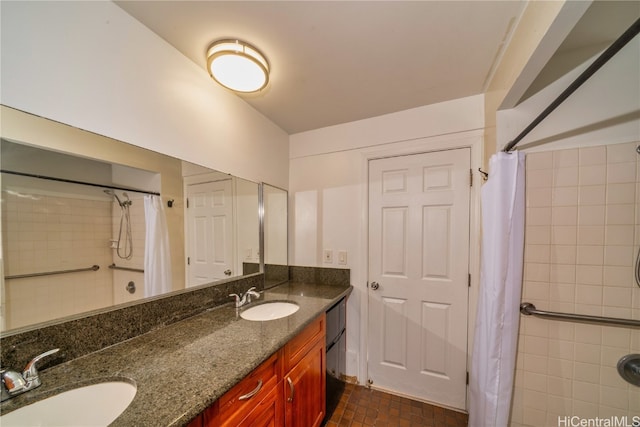 bathroom featuring vanity and curtained shower