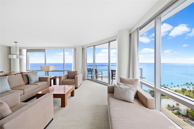 sunroom / solarium with plenty of natural light and a water view