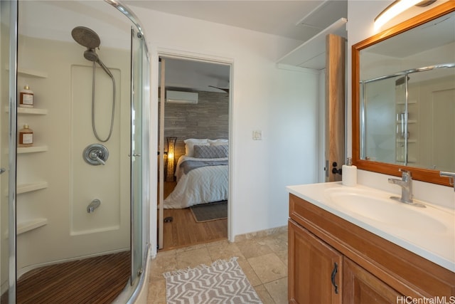 bathroom featuring tile patterned floors, vanity, and a shower with shower door