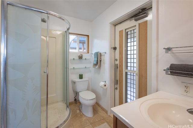 bathroom with tile patterned flooring, vanity, toilet, and walk in shower