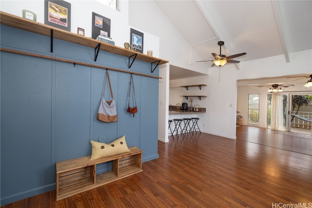 mudroom featuring beamed ceiling, dark hardwood / wood-style floors, and high vaulted ceiling