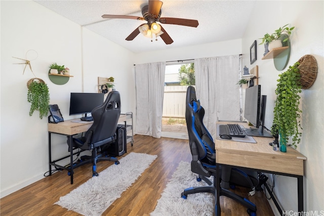 office with dark wood-type flooring, ceiling fan, and a textured ceiling