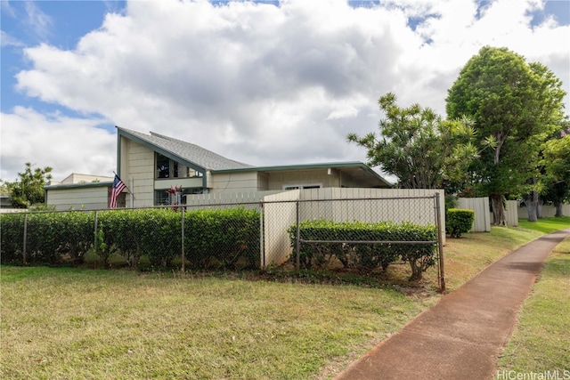 view of property exterior with a yard