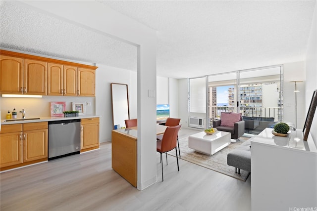 475 Atkinson Dr Unit 1702, Honolulu, HI 96814 - kitchen with dishwasher, light wood-style flooring, light countertops, a textured ceiling, and open floor plan