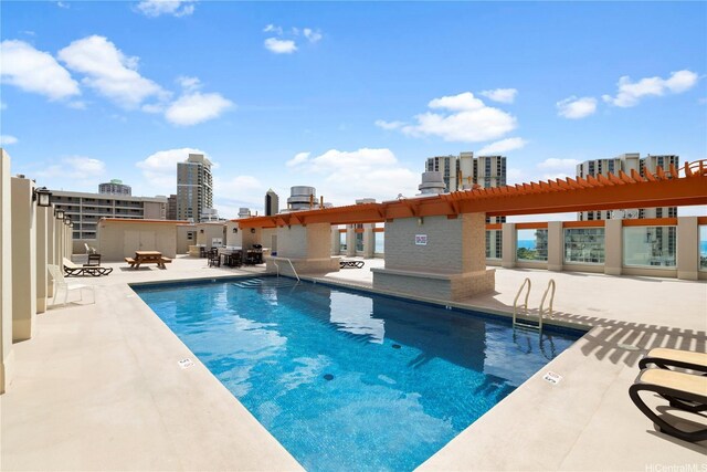 475 Atkinson Dr Unit 1702, Honolulu, HI 96814 - community pool featuring a patio, a view of city, and a pergola