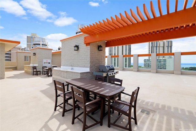 475 Atkinson Dr Unit 1702, Honolulu, HI 96814 - view of patio / terrace with area for grilling, outdoor dining area, and a water view