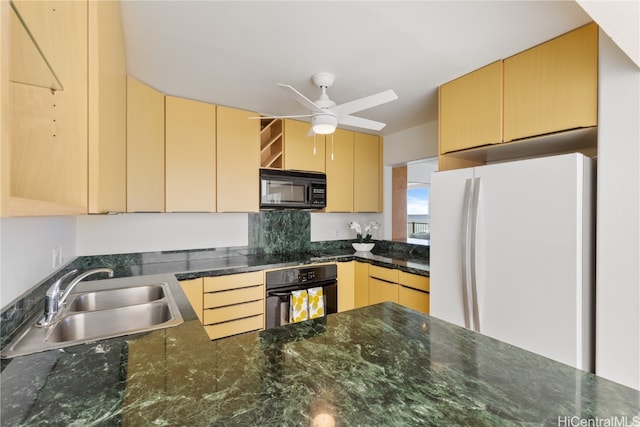 kitchen featuring light brown cabinets, ceiling fan, dark stone counters, black appliances, and sink