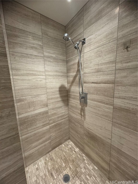 bathroom with a tile shower