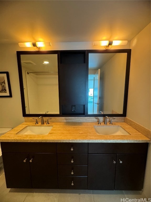 bathroom with vanity and tile patterned flooring