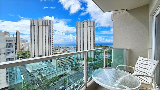 balcony featuring a water view