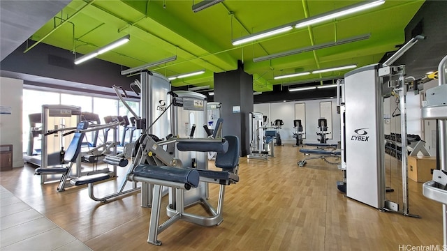 gym with hardwood / wood-style flooring