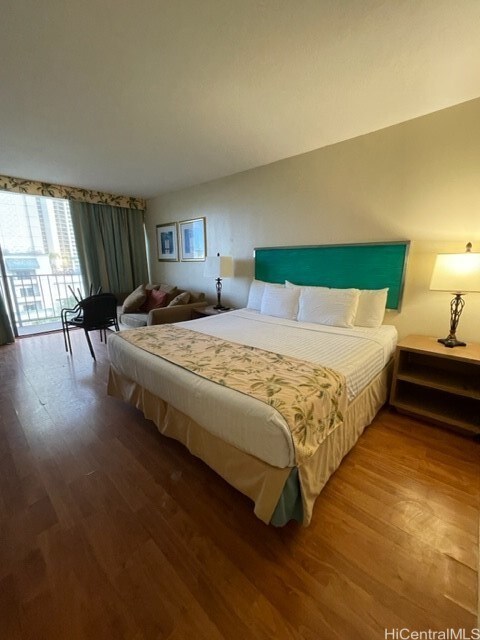 bedroom featuring hardwood / wood-style flooring