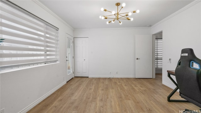 office area featuring an inviting chandelier, crown molding, and light hardwood / wood-style flooring