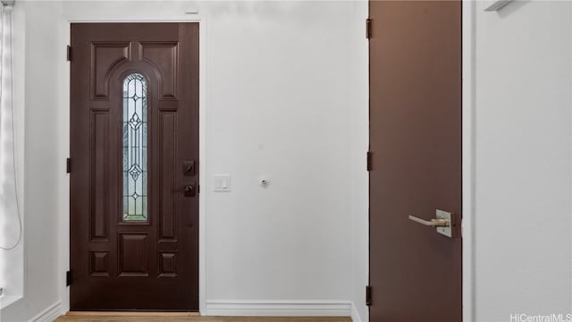 entryway with light hardwood / wood-style floors