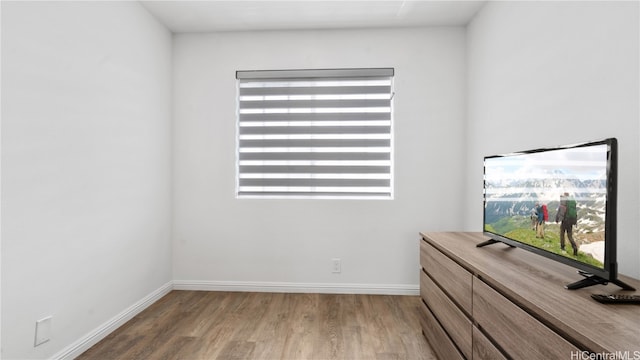 unfurnished bedroom with hardwood / wood-style flooring