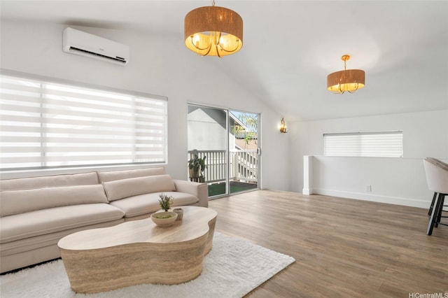 91-1030 Hoopili St Unit 54, Ewa Beach, HI 96706 - living room featuring an AC wall unit, lofted ceiling, and wood finished floors