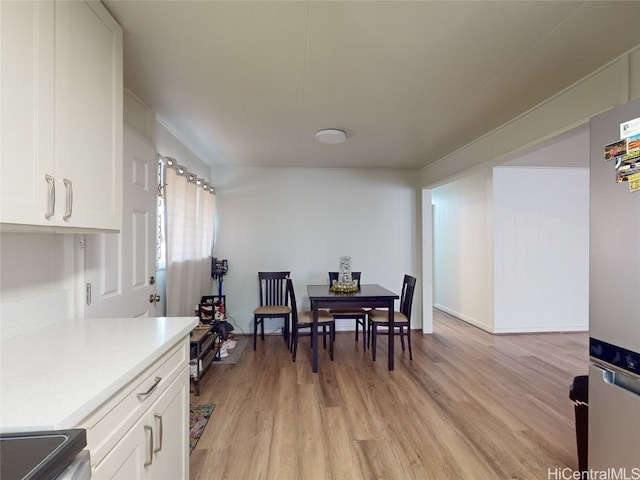 dining room featuring light hardwood / wood-style floors