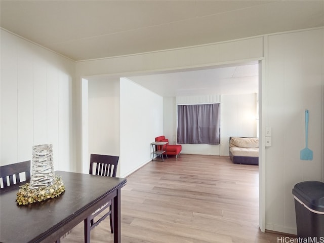 dining space with light hardwood / wood-style floors