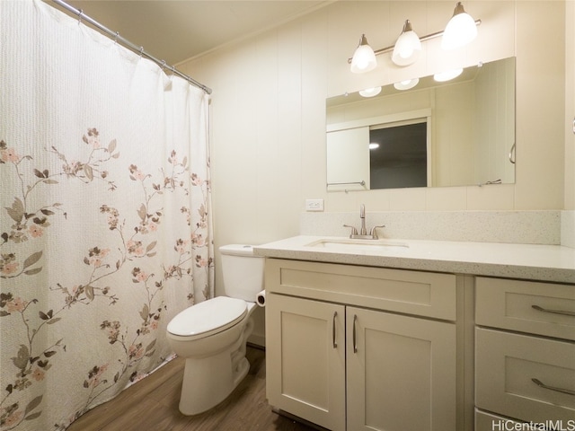 bathroom featuring vanity, toilet, a shower with curtain, and hardwood / wood-style floors