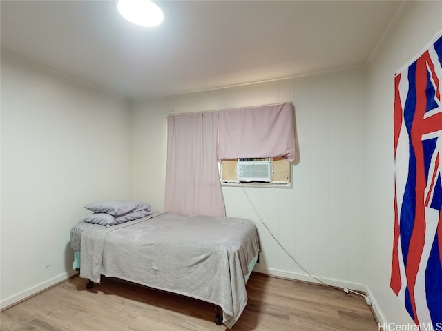 bedroom featuring wood-type flooring