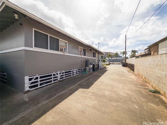 view of side of property with cooling unit