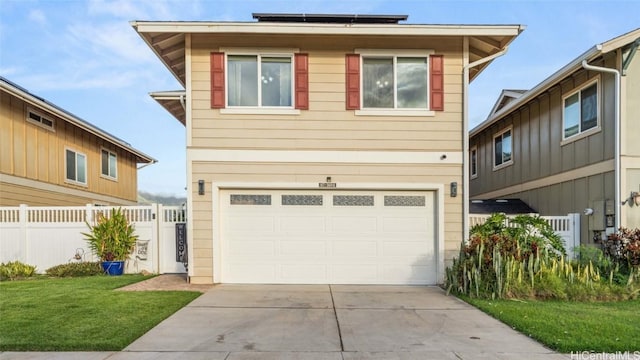 front facade featuring a front lawn, a garage, and solar panels